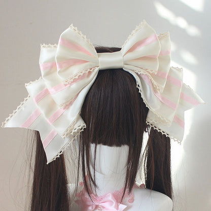 ピンクと白のストライプ柄の大きなリボンKC