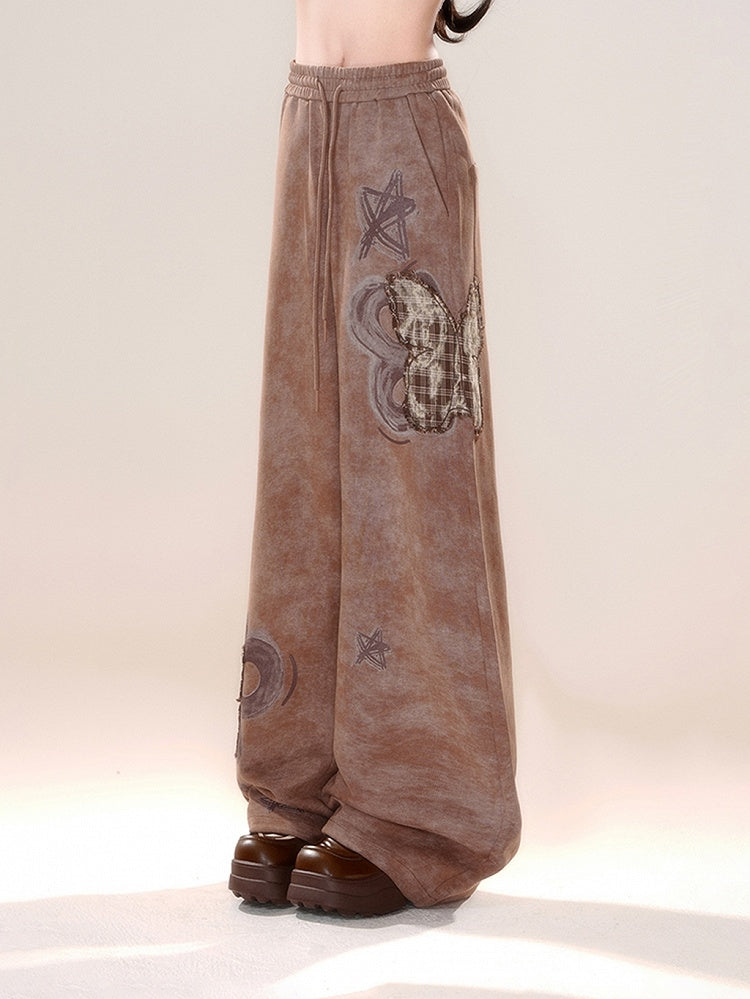 Braune Schmetterlingshose mit weitem Bein und Applikation im Karomuster