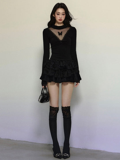 Schwarzes, langärmliges Top mit Illusionsausschnitt und Schmetterlingsakzenten