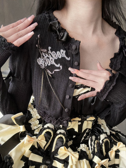 Schwarzes, langärmliges Strickoberteil mit Stickerei