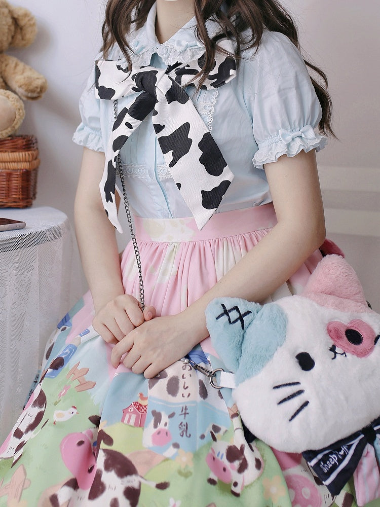 取り外し可能な袖が付いたブルーのショートパフスリーブブラウス