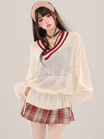 Aprikosenfarbenes, halbtransparentes, lockeres Strickoberteil mit V-Ausschnitt und gerüschter Taille