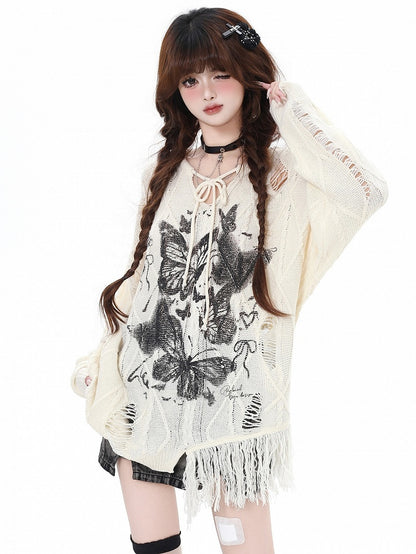 Aprikose/Schwarzes lockeres Strickoberteil mit Schmetterlingsmuster und Löchern im Used-Look und V-Ausschnitt