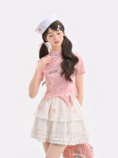 T-Shirt-Saum, gebogen, rosa Rüschen-Ausschnitt, Teddybär-Strasssteine, Schleifen-Akzente