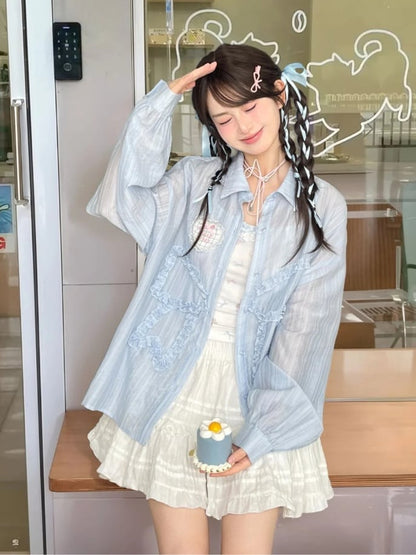 セミシースルーのフリル付き蝶結びアップリケ付きブルーサンプロテクションシャツ