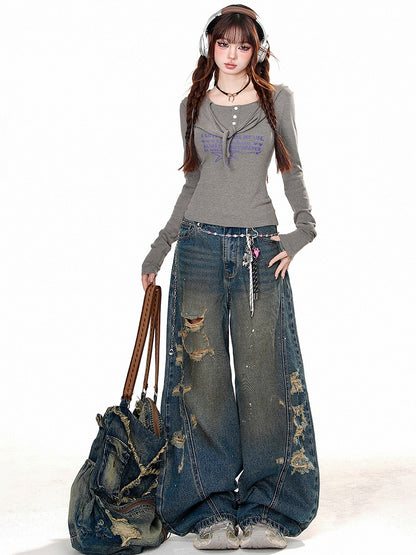 Denimblaue Distressed-Löcher-Jeans mit weitem Bein
