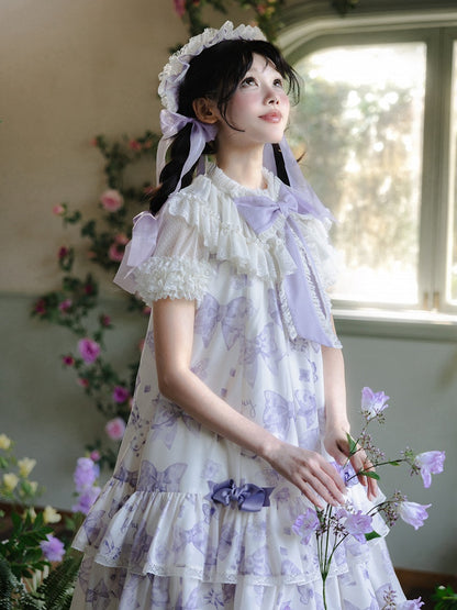 ホワイトのフリルネックライン半袖シアーブラウス