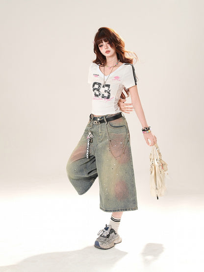 ブルーのローライズ ダメージ加工 スパンコールディテール ストレートレッグジーンズ