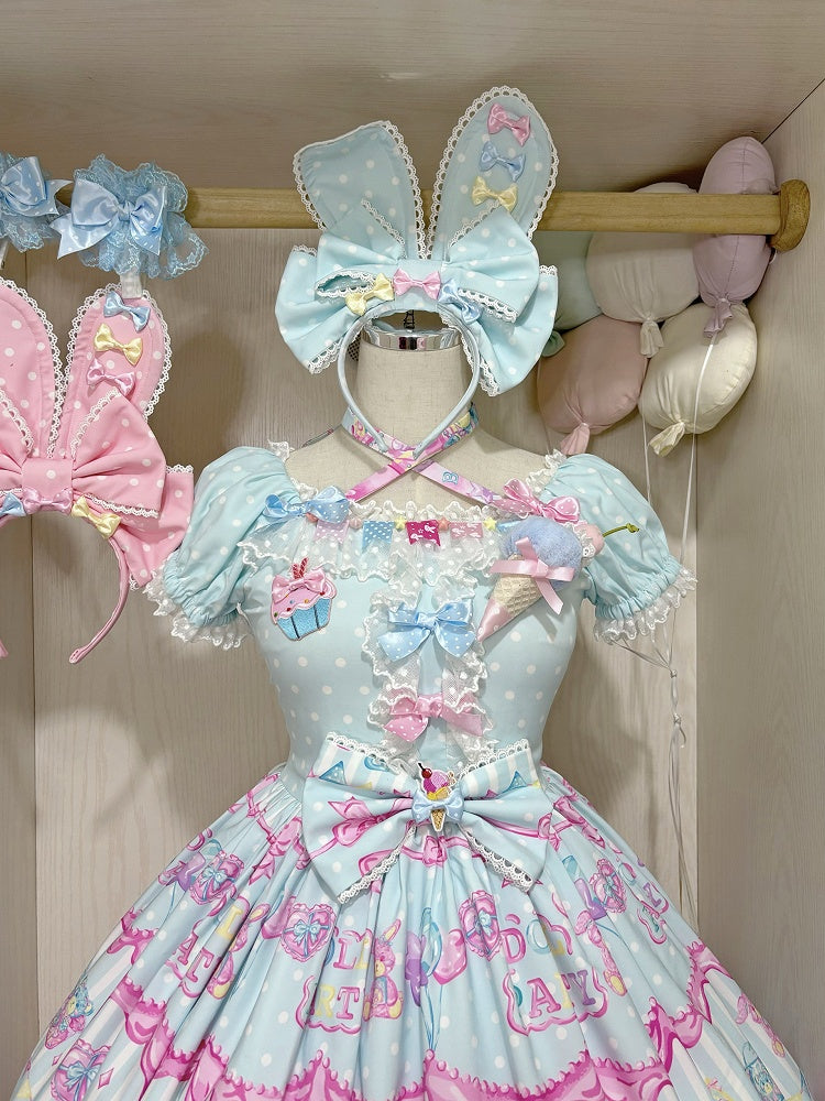 黄色と青の蝶結び、ピンクの耳のKC / バニー