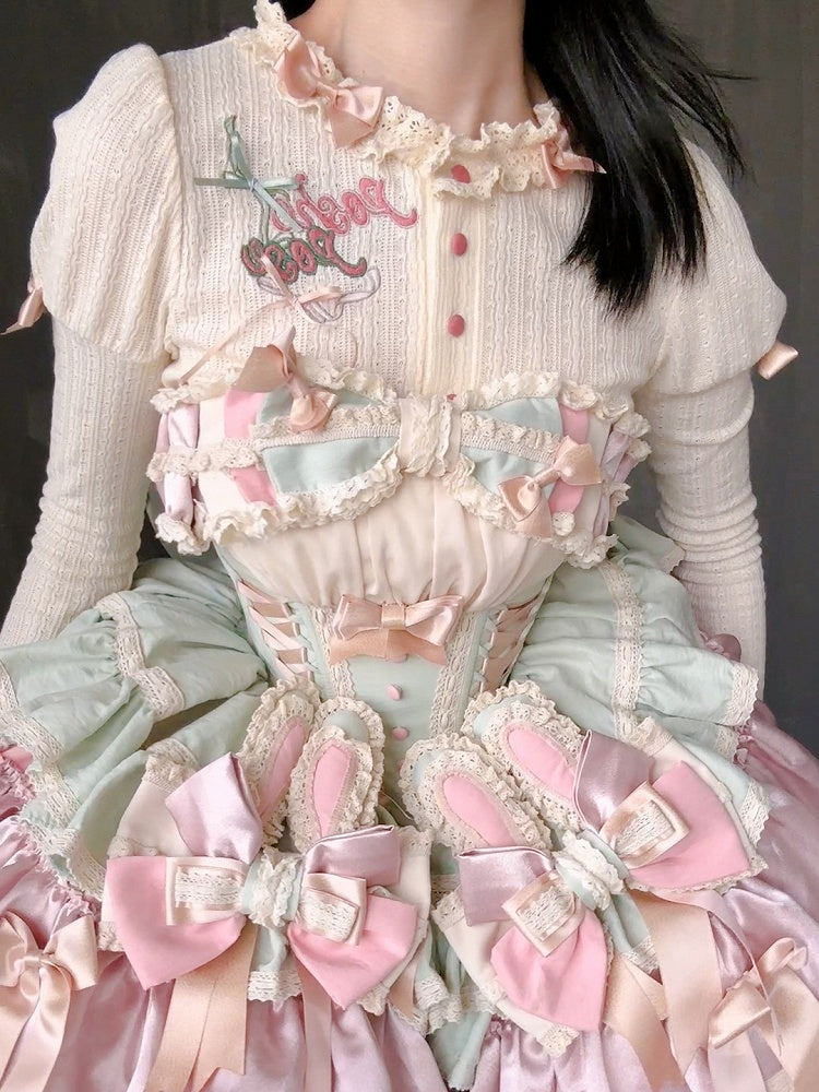 クリーム色の刺繍ディテールの長袖ニットトップス