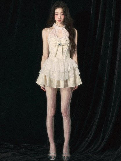 アプリコットホルターネックリボンティアードスカートドレス