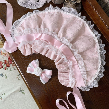 ピンクの花嫁の蝶結びで飾られたレイヤードスカートの甘い姫ロリータジャンパースカートセット