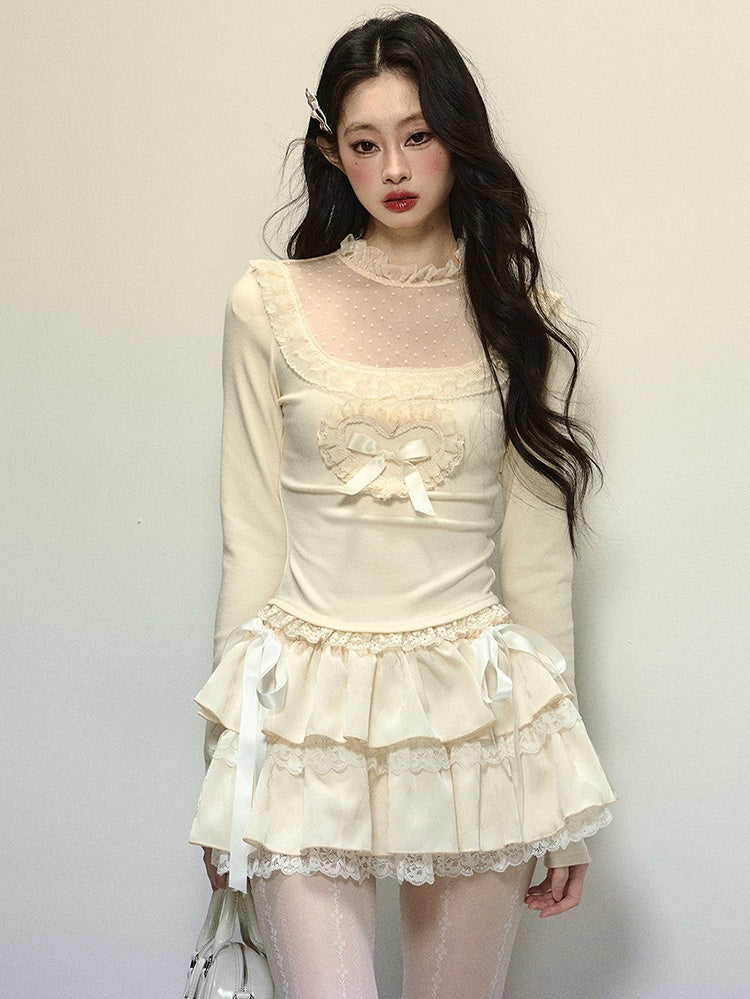 Aprikosenfarbenes Oberteil mit Illusionsausschnitt und Spitzenakzenten und langen Ärmeln