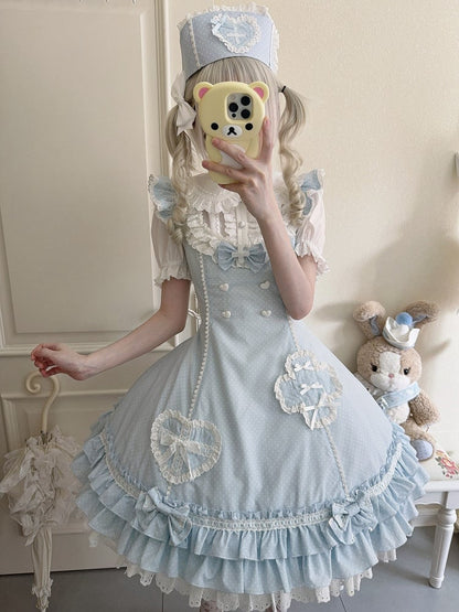 Blaues Lolita-Kleid mit Rüschensaum und Lagenmuster und Polka-Dot-Muster