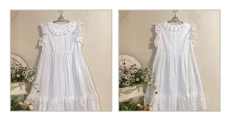 Weißes Kleid mit Ösenbesatz und Flatterärmeln