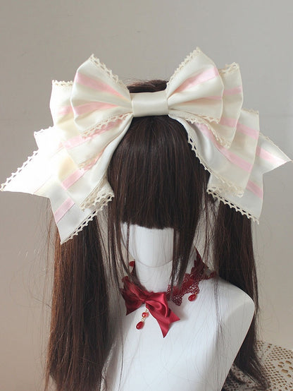 ピンクと白のストライプ柄の大きなリボンKC