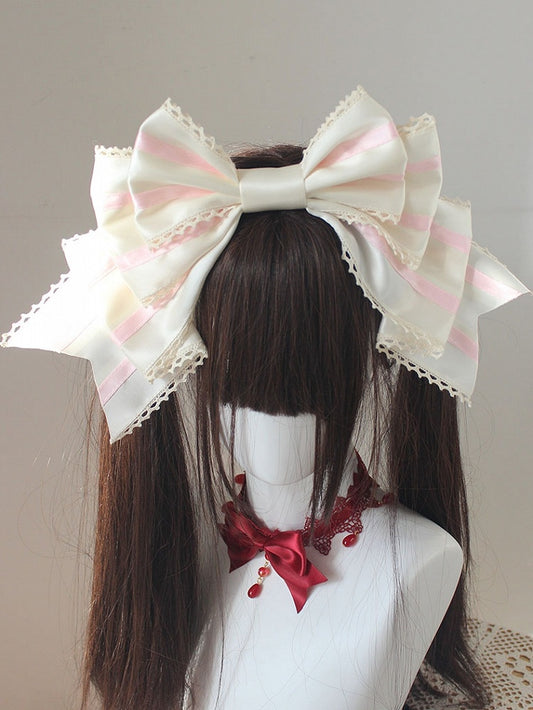 ピンクと白のストライプ柄の大きなリボンKC