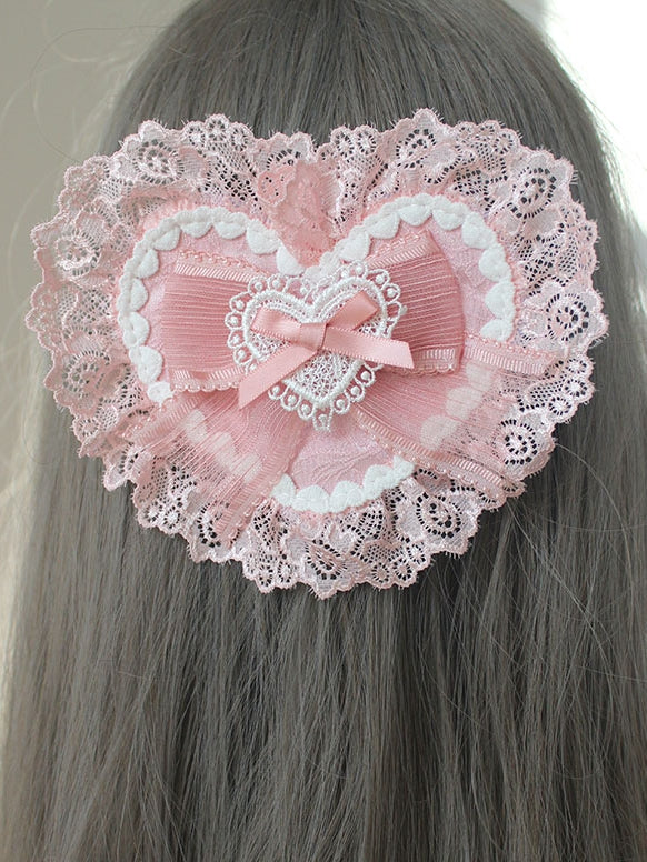 Rosa Haarspange in Herzform mit Schleife und Spitzenbesatz