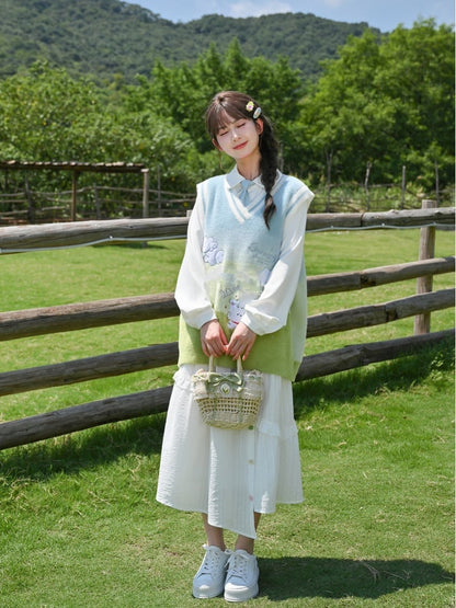 ブルー＆グリーングラデーションの子犬柄ニットベスト