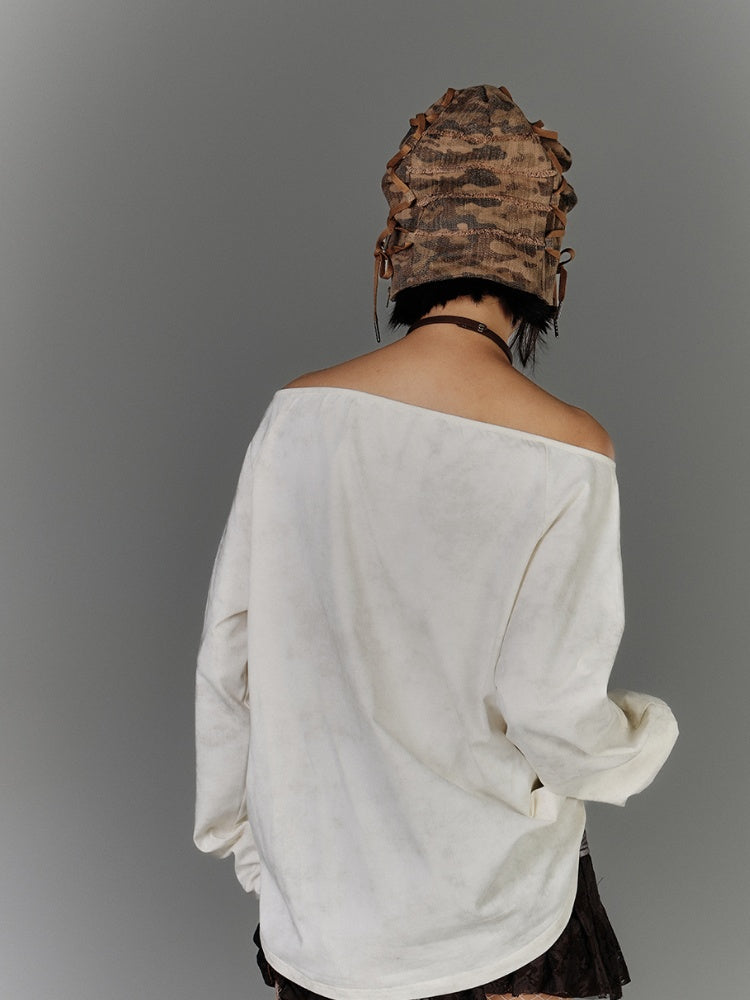 Aprikosenfarbenes, schulterfreies Baumwolltop mit Grafik und Used-Look-Ausschnitt