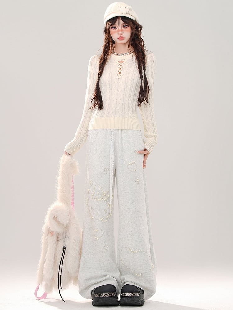 Grauer Slim-Fit-Pullover mit Rundhalsausschnitt und Cut-Out-Detail