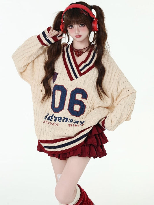 数字と文字のアプリコットプレッピールーズセーター