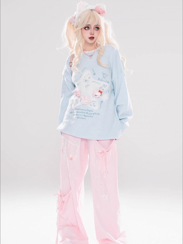 ライトブルー/ライトイエローの星のアップリケがキュートな猫ちゃんをあしらったゆったりセーター