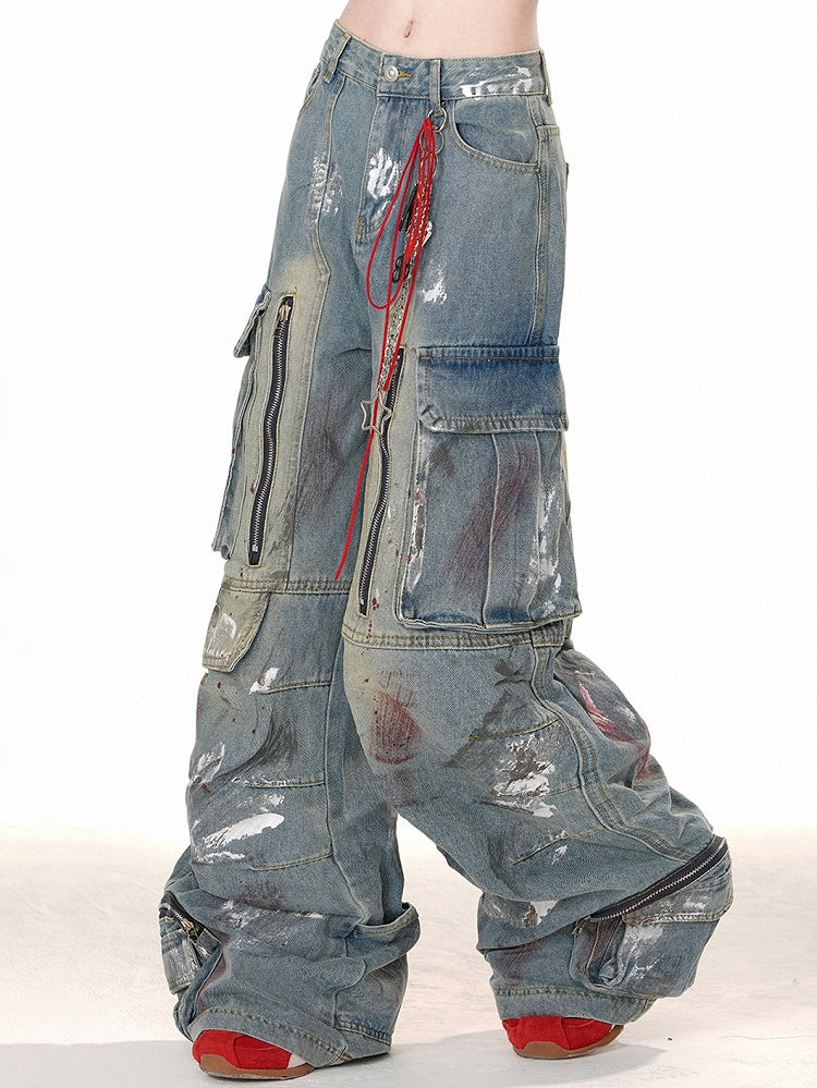 ブルーのワイドレッグカットデザイン、ジッパー付きカーゴジーンズ、スプレーペイントプリント