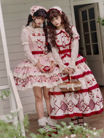 ピンクと赤のリンゴ柄の三角スカーフ