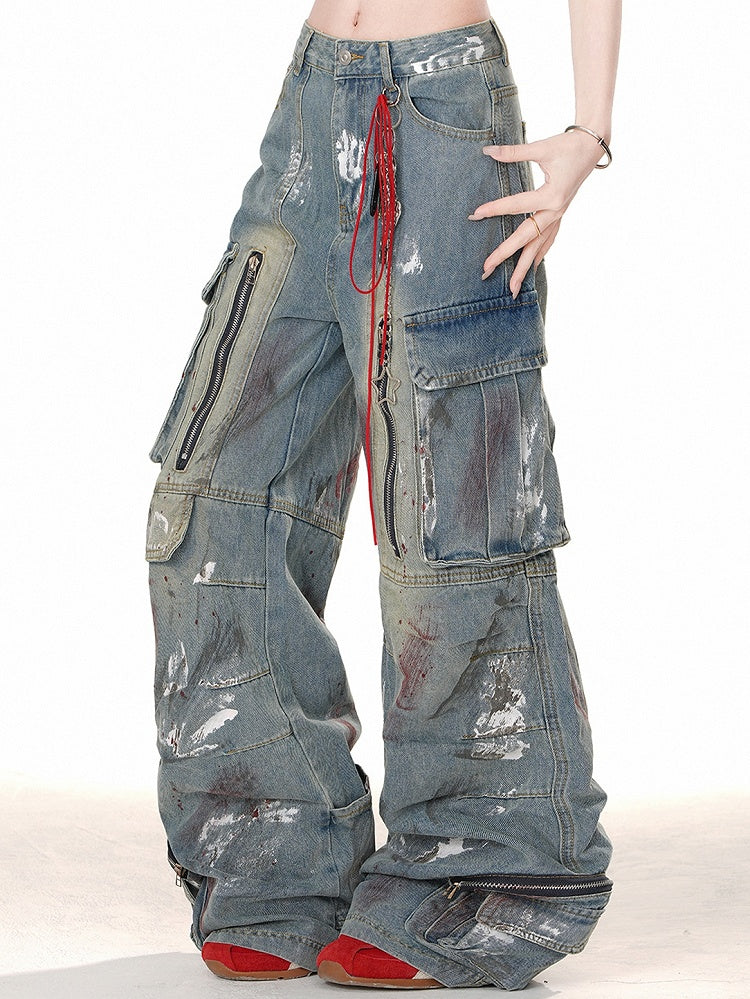 ブルーのワイドレッグカットデザイン、ジッパー付きカーゴジーンズ、スプレーペイントプリント
