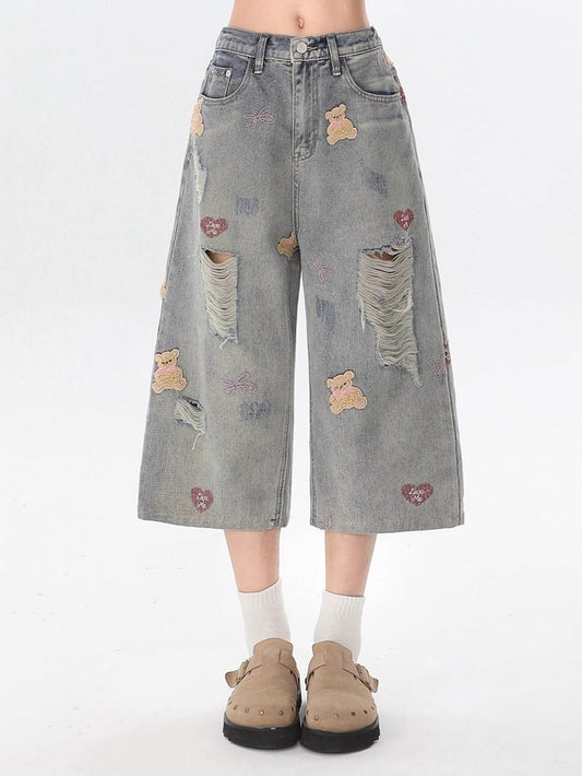 Light Gray Cropped Denim Jeans with Embroidered Bear & Distressed Design