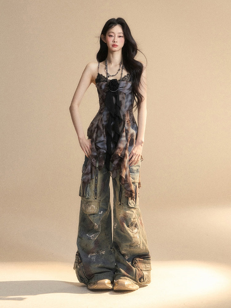 Schwarzes, asymmetrisches Camisole-Top mit Volantsaum und Blumenverzierung