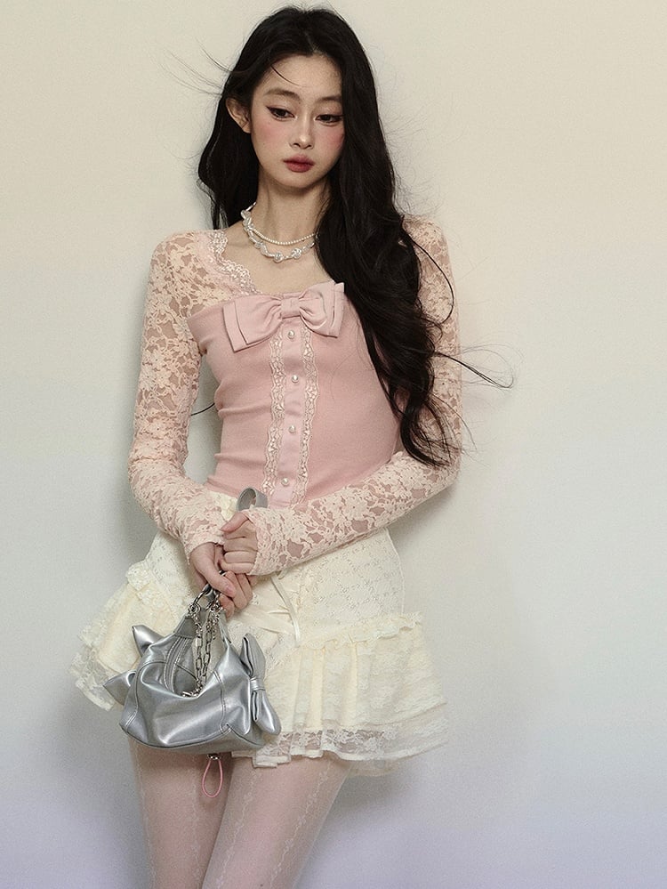 Rosa Stricktop mit Schleifendetails, Spitzenärmeln und V-Ausschnitt