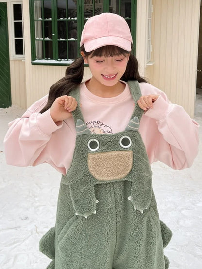 かわいい恐竜の緑のぬいぐるみオーバーオール
