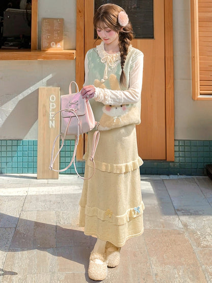 イエローのリボンがアクセントのハイウエストニットミディ丈スカート