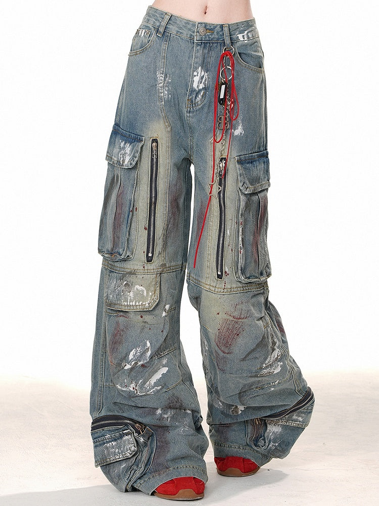 ブルーのワイドレッグカットデザイン、ジッパー付きカーゴジーンズ、スプレーペイントプリント