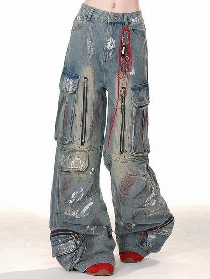 ブルーのワイドレッグカットデザイン、ジッパー付きカーゴジーンズ、スプレーペイントプリント