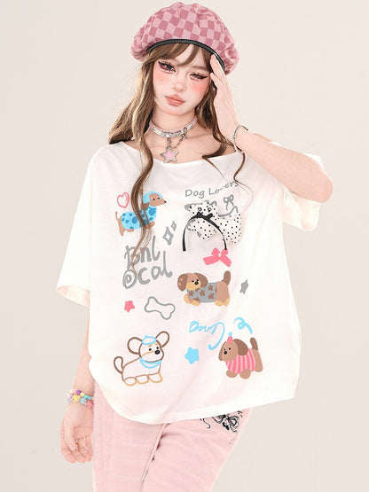 Weiß/Schwarzes lockeres T-Shirt mit asymmetrischem Ausschnitt und Cartoon-Welpen