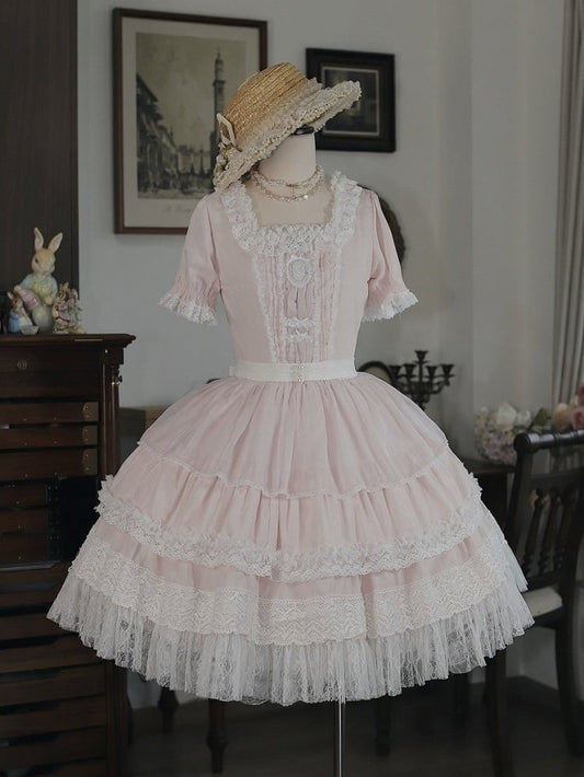 Robe OP en dentelle rose clair avec nœud – Tiny Garden