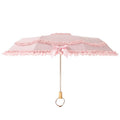 Open pink three-fold Lolita umbrella with layered ruffle lace and wooden handle