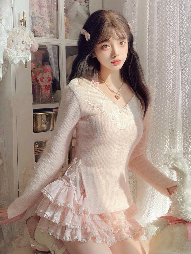 Rosa Strickpullover mit Schleifenakzenten und verspieltem Banddetail, V-Ausschnitt mit Spitzenbesatz