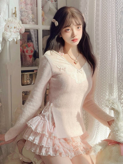 Rosa Strickpullover mit Schleifenakzenten und verspieltem Banddetail, V-Ausschnitt mit Spitzenbesatz