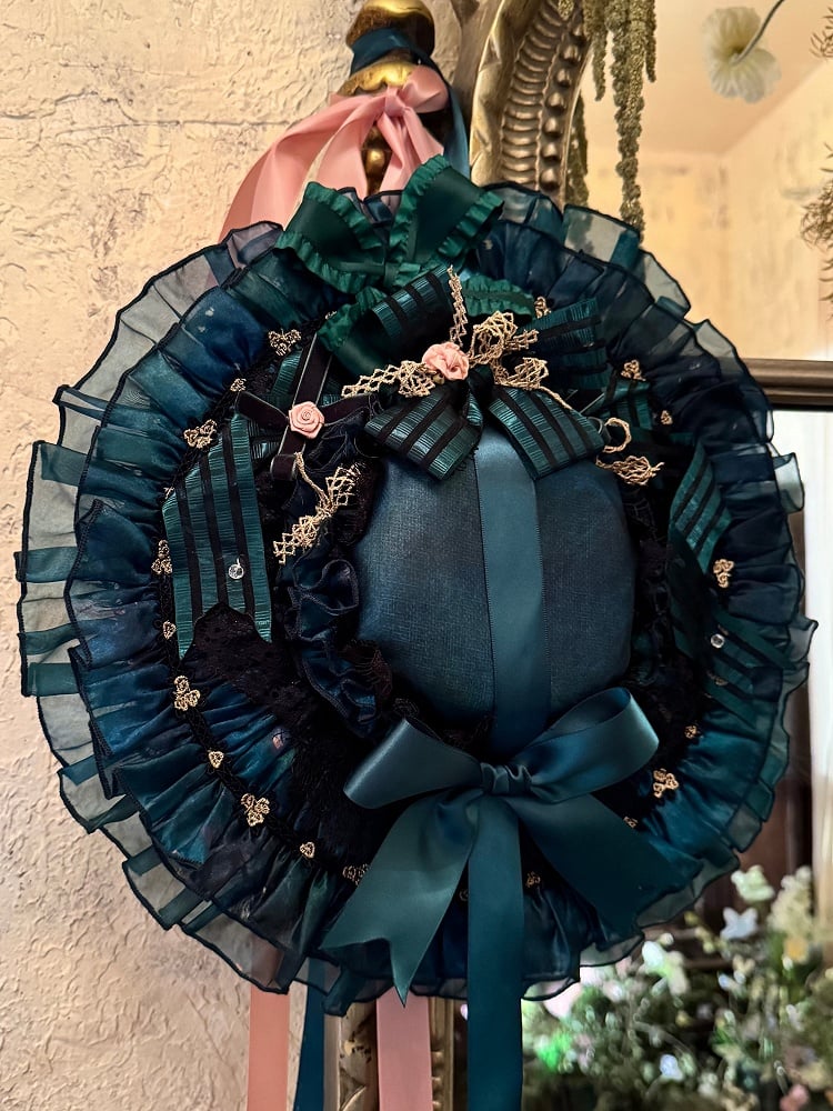 緑の蝶結びと花飾りのロリータ帽子