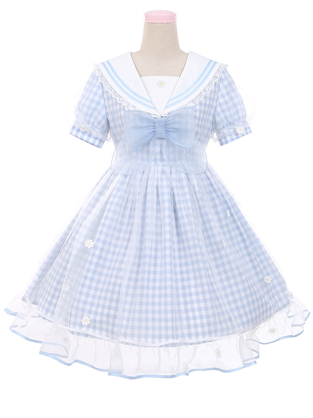 Robe à carreaux bleu clair à col marin et marguerites blanches, détails nœud papillon
