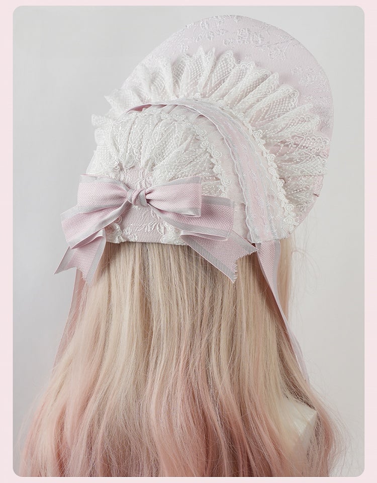 ピンクの大きなリボンと花柄のフリルレーストリムのロリータボンネット