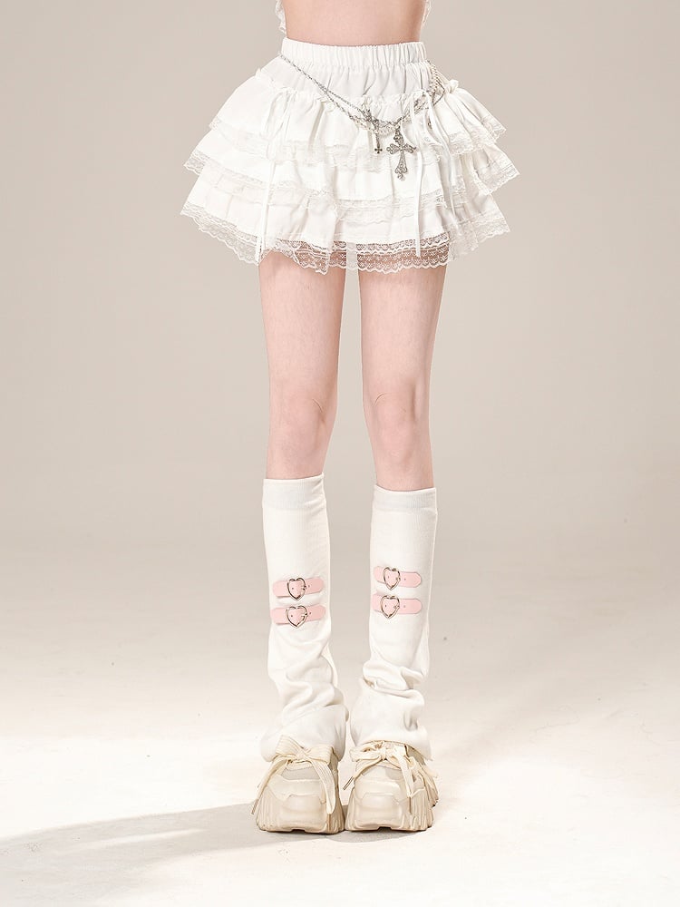 伸縮性のあるウエスト、蝶結びのディテール、ホワイト/ブラックのレーストリム、ティアードスカート