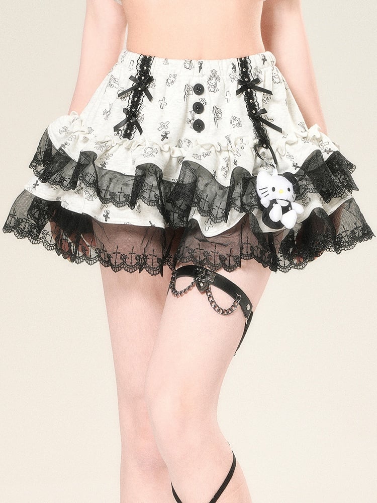 蝶結びのディテール、レースの華やかさ、スカートのクロスプリント、グレーのトリム、ティアードキティ