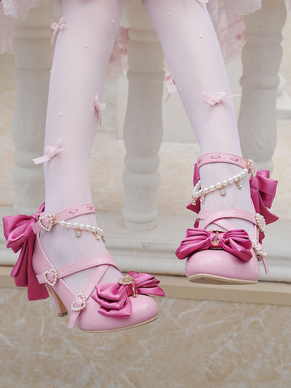 クリスクロストップにハートとローズのビーズリボンをあしらったピンクのチャーム