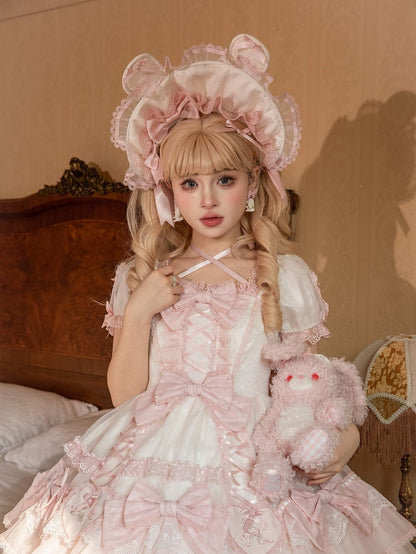 ピンクと白/黒のボンネット耳のウサギ