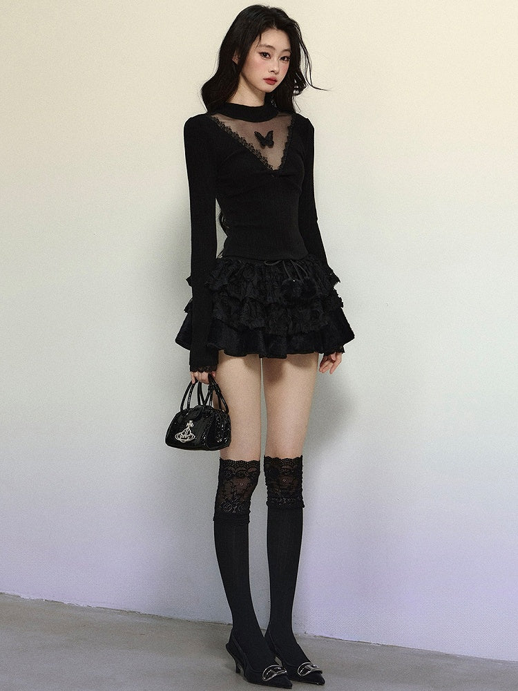 Schwarzes, langärmliges Top mit Illusionsausschnitt und Schmetterlingsakzenten